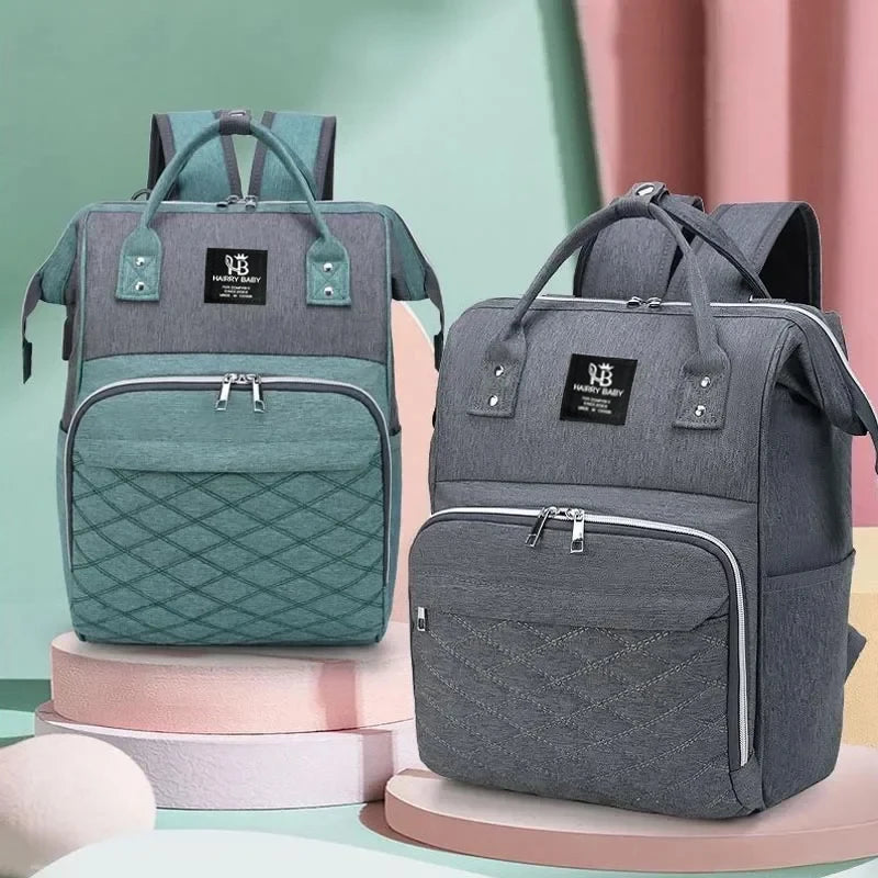 Sac à dos à langer, coloris vert d'eau et gris